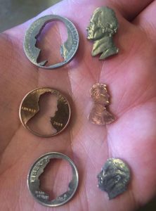 Coins With The Heads Cut Out