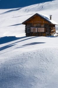 Wooden House on Snow